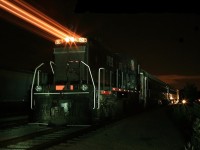 On a hot summer night in 2009 the Guelph Junction Express dinner excursion train has just returned to its home base which actually was in in Guelph Junction at that time, before they moved it to Arkell. Ontario Southland looked after the operational side of things and RS-23 506 was the "dedicated" power, complete with the Sleeman logo on the cab (Sleeman was a corporate sponsor and supplied the beer for the excursions, of course). We had spent the day doing promotional photography at the request of Rita and John Carroll, the train's owners. As John unloaded the coaches in the background I had asked the crew to wait until I had finished "painting" the loco with light before uncoupling the locomotive and driving off to park it. When I killed my big HID spotlight Bruce released the brakes and drove out of the frame, resulting in this image.