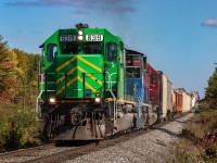 Negotiating some of the grades along the McAdam Sub, NBSR 6319 is westbound, as they approach Cork, New Brunswick, nearing the mile 59 hotbox on the McAdam Sub. 