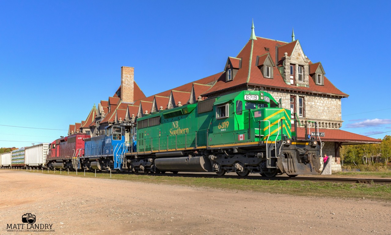 After some work and a recrew, NBSR 6319 is westbound as they slowly pass the infamous McAdam Railway Station on a beautiful Fall afternoon.