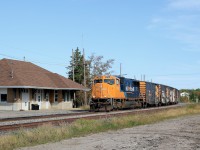 Passing by the closed station in Matheson, 2104 slowly leads a good sized train northwards en route to Cochrane.  Today's 213 had 69 cars including 43 box cars on the head end.