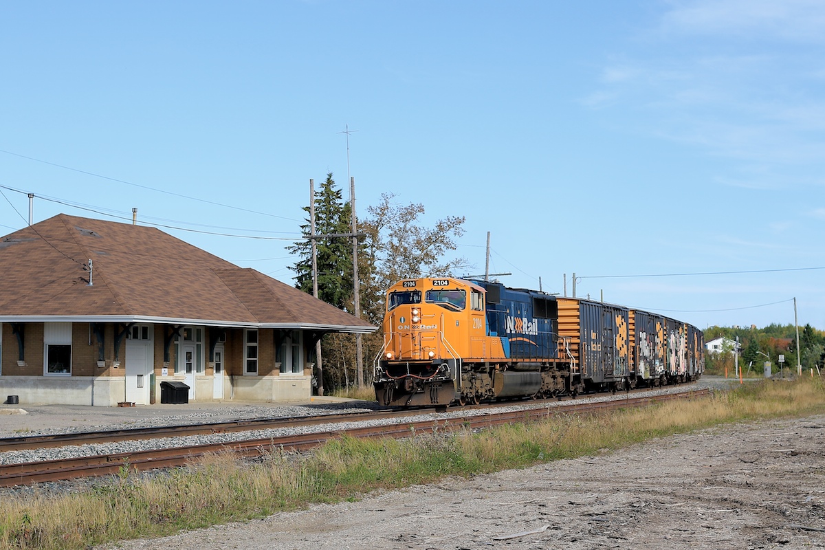 Passing by the closed station in Matheson, 2104 slowly leads a good sized train northwards en route to Cochrane.  Today's 213 had 69 cars including 43 box cars on the head end.