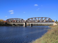 I first encountered this impressive bridge several years ago while driving on Hwy 11 towards Kapuskasing.  From what I can gather, the bridge was constructed around 1909-1910 when the National Transcontinental Railway was being built across Northern Ontario.  According to their town website, Fauquier was named after the brothers who were in charge of constructing the bridge. On this day I found ONT 2200 leading 30 cars on their way from Hearst to Cochrane.