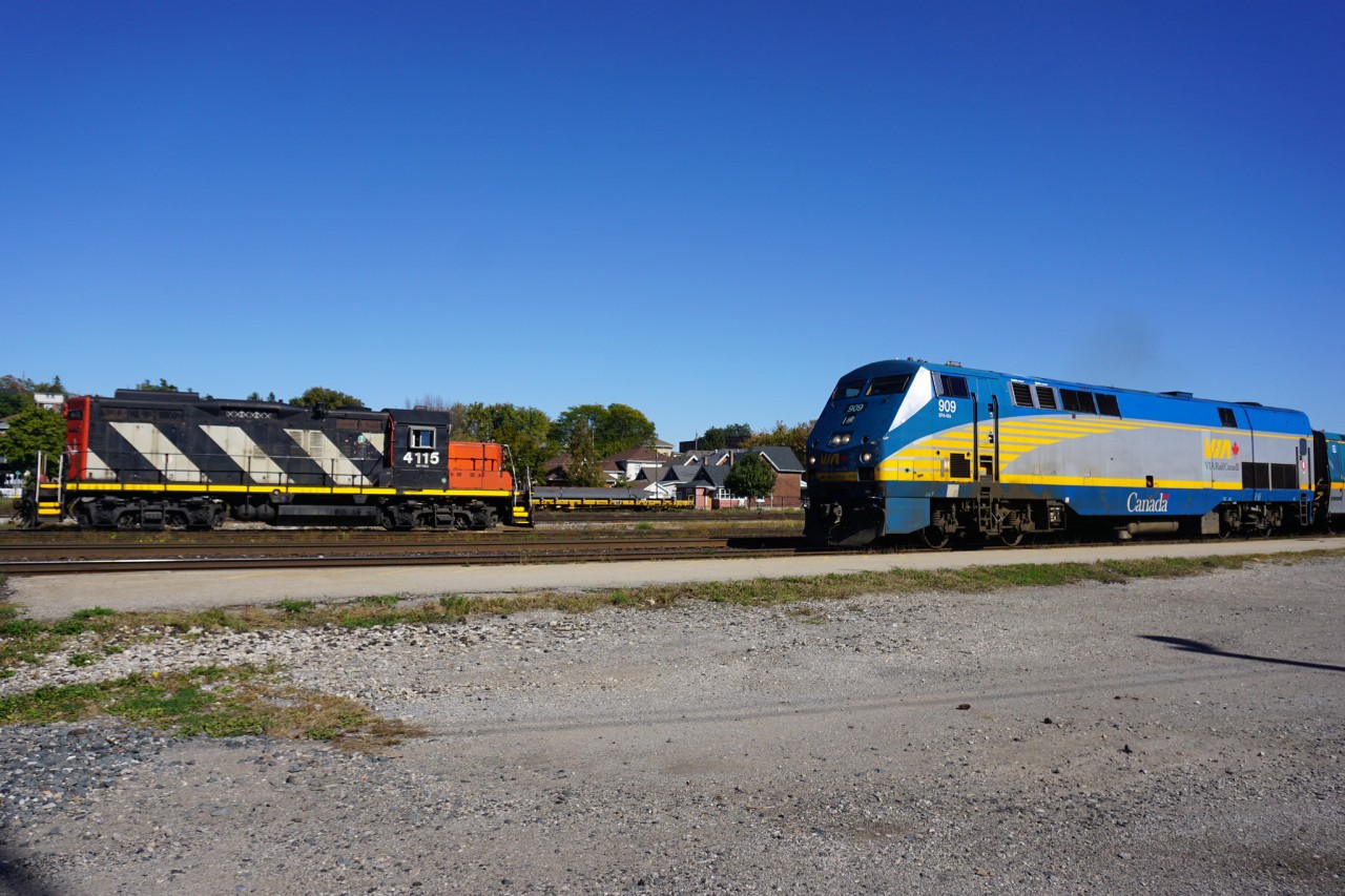 The westbound Via meets 580 switching cars in the yard.