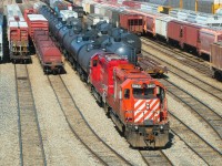 CP 5863 and CP 6000 shunt some cars around in the Winnipeg Yard. CP 5863 was one of only two remaining units on the CP roster with the full-sized multimark (the other was CP 5911).<br><br>Fast forward to 2016, and there are very few active SD40-2's on the active CP roster, the rest are all in storage. I miss seeing them on trains, and even just shunting in the yards. At least they were operating.