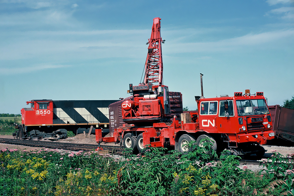 Derailment of CN MLW M-420(W) 3550 with CN Kershaw Rail Crane RC75762 working on the wreck scene. August 16, 1992.