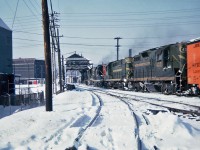   Westbound Canadian National freight crossing the Lachine Canal with in the lead MLW RS-18 3681,GMD GP9 4472, RS-18 3644 and GP9 4321. Montreal, Quebec Feb.05,1965.