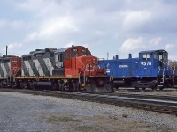 Canadian National GMD/CN GP9RM 4101 and 4105 with Conrail EMD SW1001 9578 at Fort Erie's CN yard October 23, 1987.