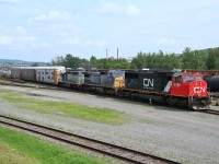  Canadian National EMD SD75I 5786 with CSX C40-8W 7663 and CN(GTW) SD40-3 5955 westbound at Edmundston,New Brunswick  July 12, 2006. 