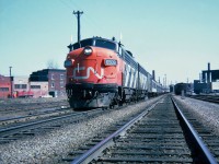    One of many CN Montréal-Toronto daily passenger trains, leading this westbound train GMD FP9(A)6508. Montréal, Québec April 21, 1965.