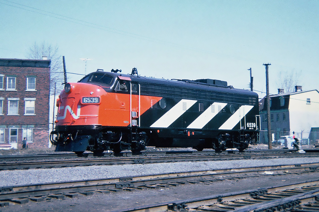 Canadian National GMD FP9(A) No.6539 fresh out of the paint shop, I could smell the new paint as it slowly went by. Montreal, Quebec April 12, 1965.