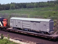 Trailing the CN eastbound up the Halton Sub in <a href=http://www.railpictures.ca/?attachment_id=26365><b>the previous photo</b></a> was CN flatcar 667157 loaded with this new narrow-gauge boxcar numbered K14301, which appears to be built by National Steel Car in Hamilton ON (note the round NSC logo at the bottom right). I think it is 42 inch, the gauge used in most British colonies (including Newfoundland) and suspect it is for Africa - I was in both Zimbabwe and South Africa and saw many cars there that resembled this one.