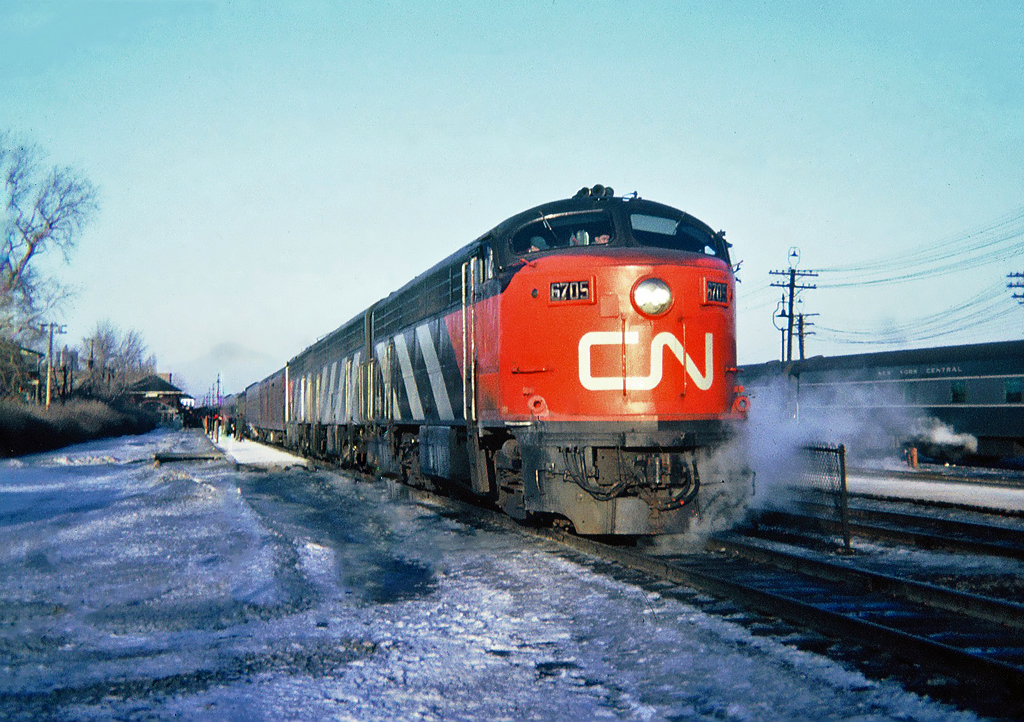 Late afternoon CN-CP pool train The International Limited, bound for Toronto at Canadian Pacific Westmount Station. In charge is CN's CLC (FM) passenger C-Liner CPA16-5 No.6705 with GMD FPB NO.6601 and MLW FPA-4 No.6783 March 19, 1965.
