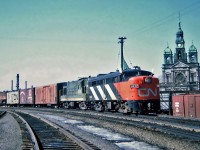 CN MLW FA-2 No.9432 and CN CLC (FM) H16-44 No.2206 with an eastbound train, March 20, 1965.
