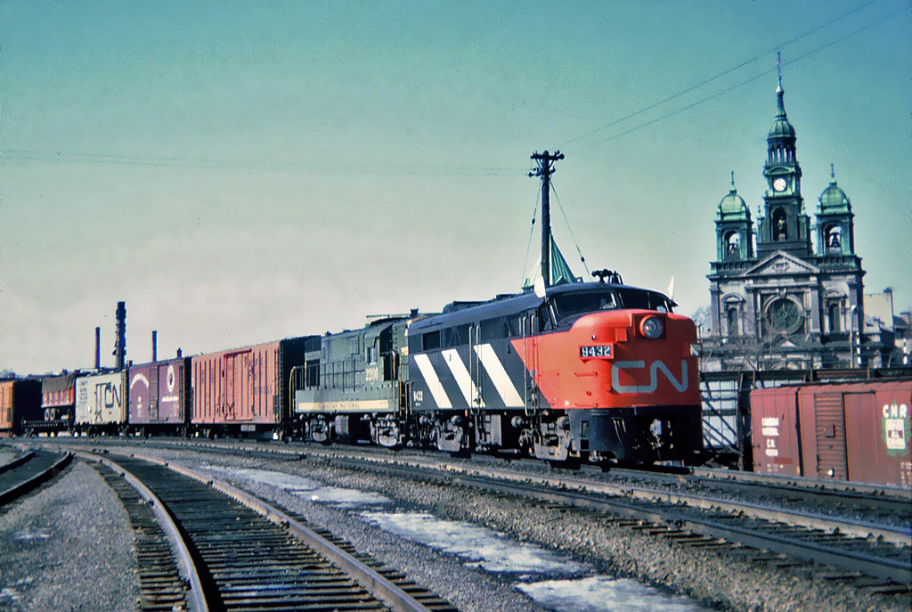 CN MLW FA-2 No.9432 and CN CLC (FM) H16-44 No.2206 with an eastbound train, March 20, 1965.