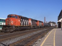 October 14th 2000 finds a trio of CN GMD's all still decked out in zebra colours passing through Georgetown station. 