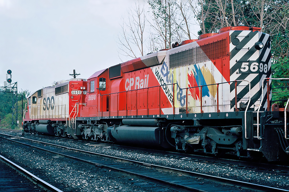 Westbound CP train with in the lead Soo Line SD40-2 6608 with CP Rail SD40-2 5698 Expo86/Vancouver unit.