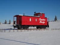 Rebuilt and freshly painted for static display at CP's Ogden Yard Headquarters in Calgary, this end cupola unnumbered caboose looks great on a sunny but cold November day.