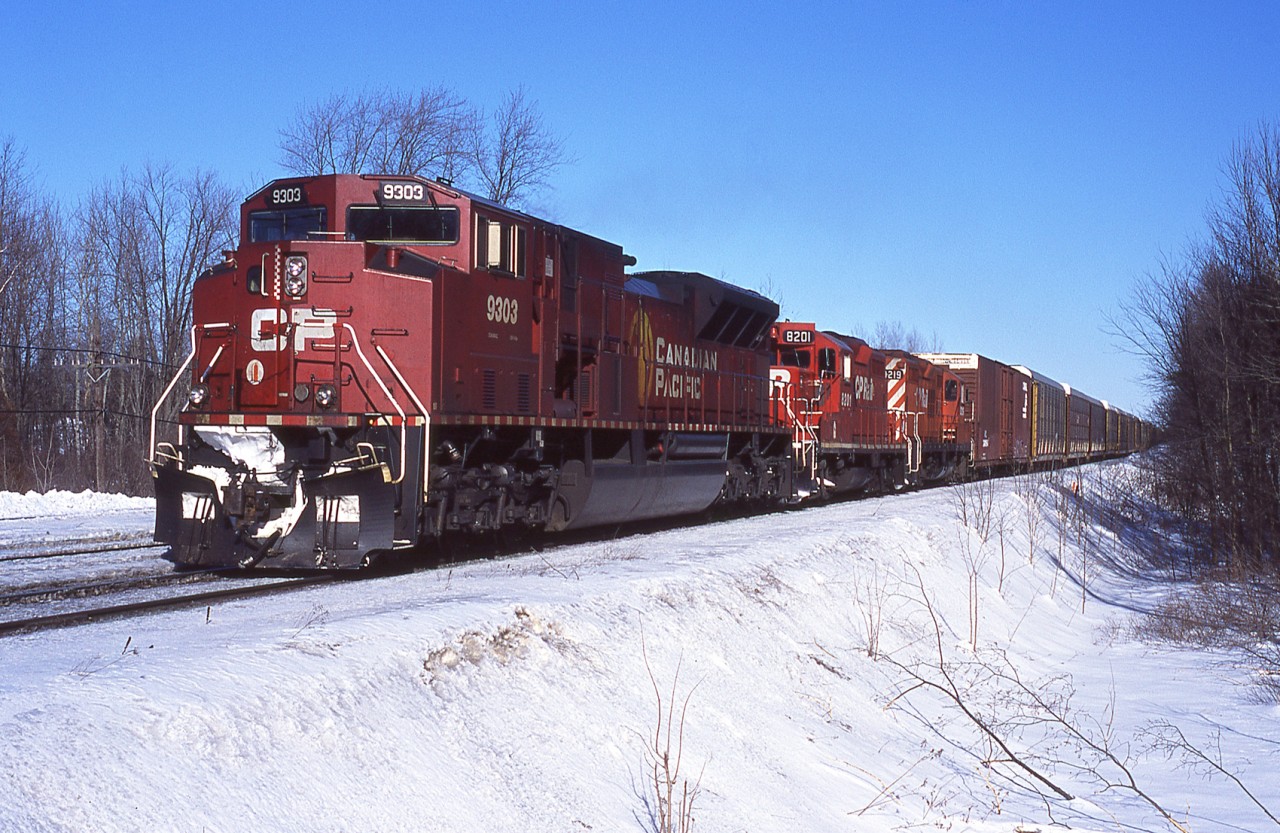 I'm not usually one to say "never", but I think is a consist one will likely never see again. On a cold but clear February 2004 day a combination 427/Ham-Turn passes through Guelph JCT with SD90MAC-H 9303 and GP9u's 8201, 8219.