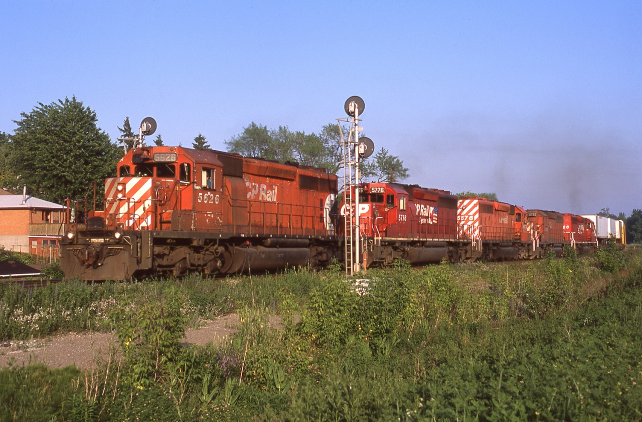 Toronto-Binghamton (via the D&H) train 558 was a pretty reliable sight in Streetsville around 19:30. One of the main ways to identify it was the TOFC traffic on the head end, another was a large locomotive consist. On June 11, 2001 CP 5626, 5776, 5576, 5762 and 5566 split the intermediate signals at the west end of Streetsville GO Station.