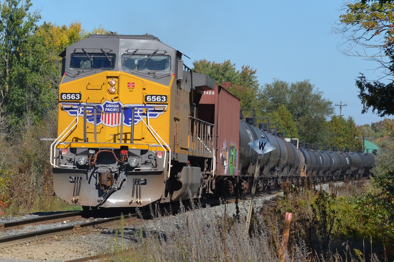 UP 6563 gets a push from the rear approaching Wolverton after meeting CP 235 at Coakley