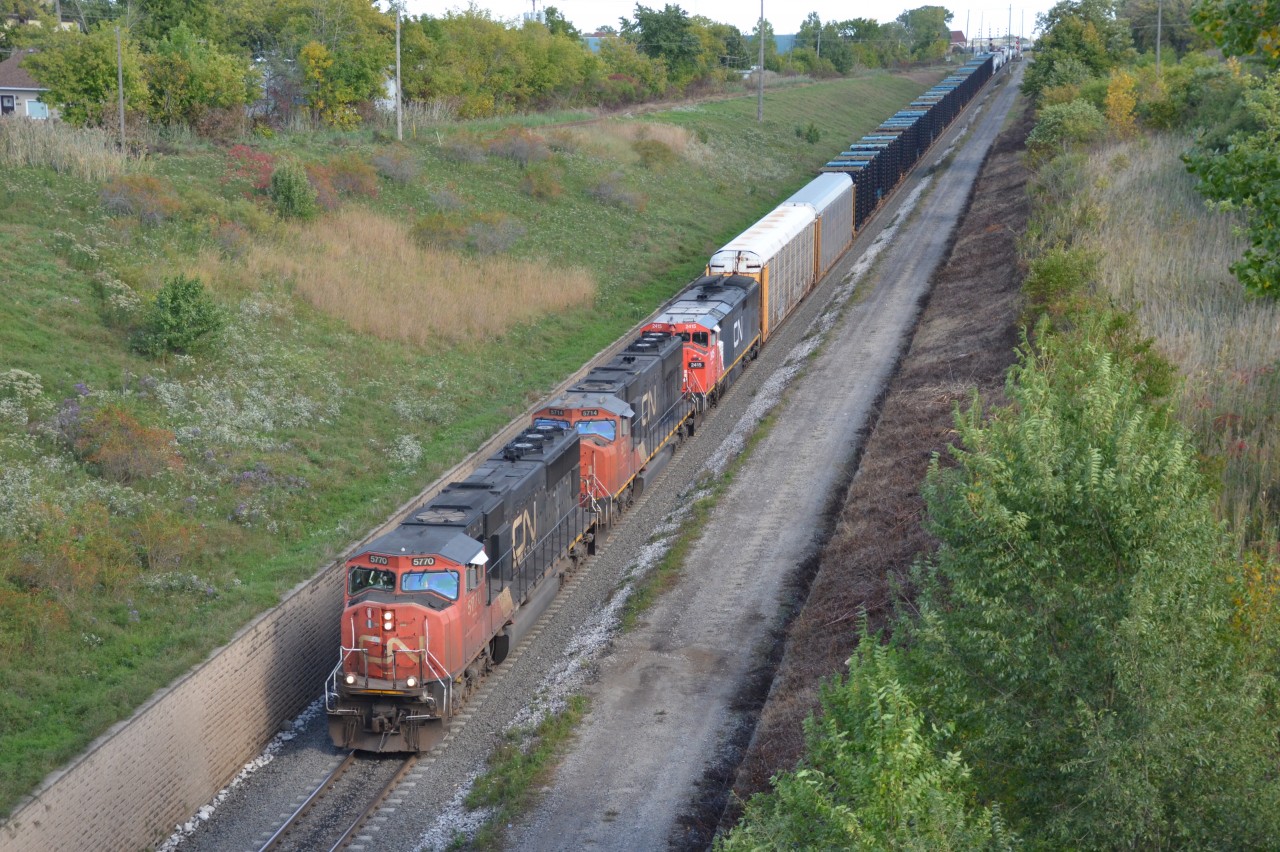 CN M385 cruises down the grade towards the entrance of the Paul M. Tellier International Tunnel