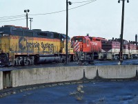  Chessie System (B&O) EMD GP40 No.3711 with a CP Rail GMD SD40 No.5525 and three stored Toronto, Hamilton & Buffalo switchers, two EMD NW2s numbers 54 & 53 and a GMD SW9 No.56  October 23, 1987.