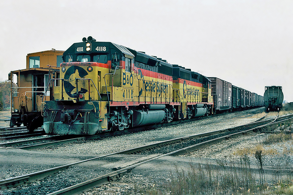 Chessie System (B&O) EMD GP40-2 No.4118 with (C&O) EMD GP40 No.4065 and a CP Rail caboose 434058 at Niagara Falls, Ontario CP Rail yard October 22, 1987.