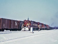 Two Duluth, Missabe and Iron Range SD9's exemplify some of the diverse, leased power that worked both the CN and CP during the mid-60"s.Number 104 and sister 152 work west with an extra at Montreal in February 1965.