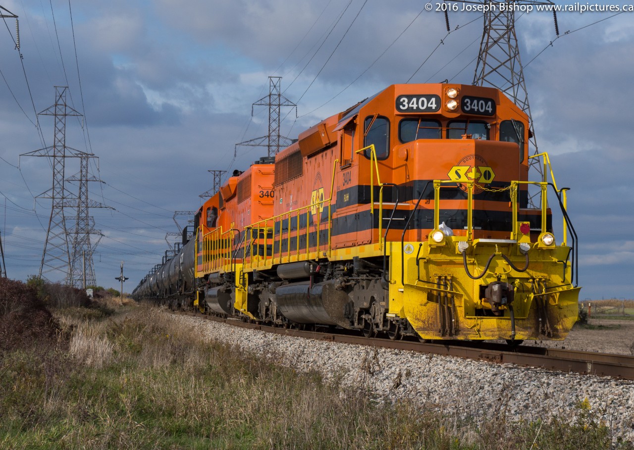 My kind of pumpkins for halloween...RLHH 3404 and RLHH 3403 are seen lifting tank cars off of the old CN Cayuga Subdivision portion of the Wye at Garnet.  They are pulled clear across Highway 3 at this point.  After a day spent teaching and halloween festivities heading out to the SOR was a fun call.  Fellow railfan Glenn Cherry was down at the crossing waiting for them to shove back clear of the road.