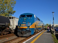 <b>A battered P42DC.</b> Battered P42DC VIA 912 leads a westbound to its stop at Dorval as CN 377 passes at left.
