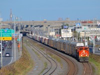 CN 401 with CN 8819 & CN 2183 for power slowly approaches Turcot West, as the train will have to wait for VIA 67 to pass on the north track of CN's Montreal Sub. Not too long after getting going again they will be stopped by the hotbox detector at MP 5 which told them they had a hot axle.