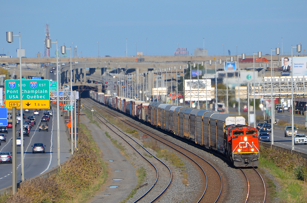 CN 401 with CN 8819 & CN 2183 for power slowly approaches Turcot West, as the train will have to wait for VIA 67 to pass on the north track of CN's Montreal Sub. Not too long after getting going again they will be stopped by the hotbox detector at MP 5 which told them they had a hot axle.
