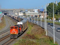 CN 401 with CN 8819 & CN 2183 for power slowly approaches Turcot West, as the train will have to wait for VIA 67 to pass on the north track of CN's Montreal Sub. Not too long after getting going again they will be stopped by the hotbox detector at MP 5 which told them they had a hot axle.