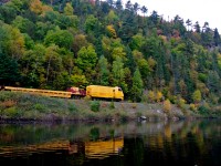 A Herzog MPM Multi-Purpose Machine heads north out of Canyon Station on the ACR line in the Agawa Canyon.
The crew is heading into the middle of a J.E.H. MacDonald landscape.
Shot from a canoe on my annual trip down the Canyon.