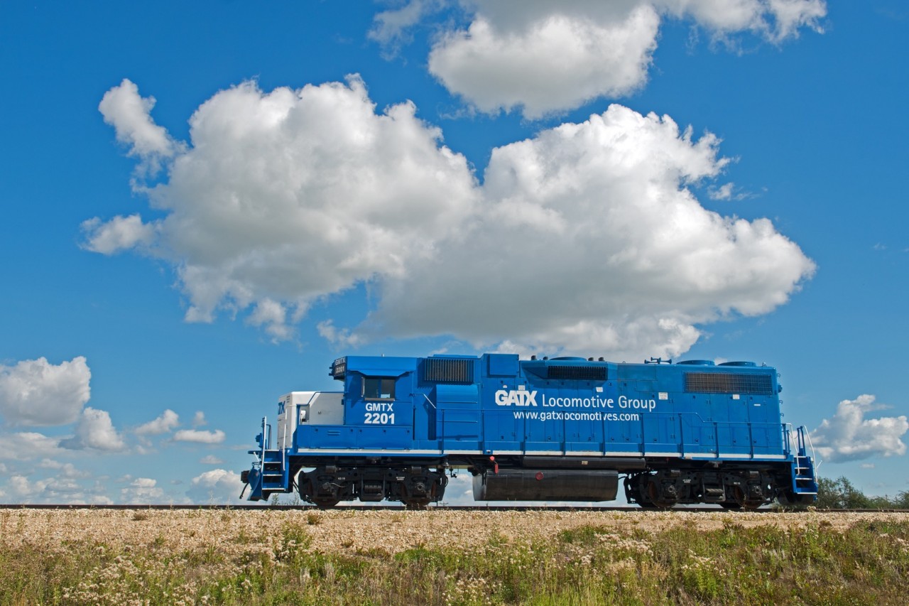 A new sand transfer station in Wembley Alberta has leased GMTX 2201. I can't help but notice that there are four exhaust stack's bracketing the fan above the dynamic brake blister. I don't suppose anyone can shed some light on the heritage of this feature ?