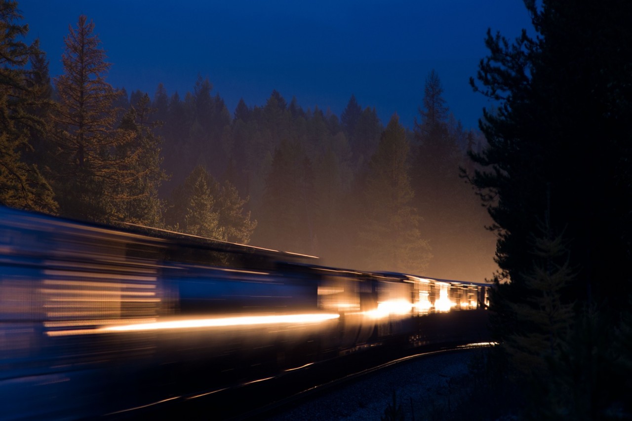 I had originally set up this shot to capture the glint from an approaching westbound's headlights on some stored ballast cars in the backtrack at Swansea but things didn't go as planned. It turned out that a meet was taking place and the first train to arrive would be an eastbound on the closest track headed away from me with its lights extinguished, drat!  But all was not lost, the first dozen or so cars on the eastbound were gondola's so when the westbound neared and turned on the brights after passing the head end of the eastbound, the light fell nicely over both sides of the eastbound and with a quick exposure adjustment I went away satisfied.