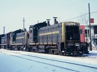  Central Vermont train 444 returning to Italy yard at St.Albans, Vermont, leading the train three EMD SW1200s two Grand Trunk Western Numbers 1511 and 1510 with a Central Vermont No.1500   December 14, 1965.