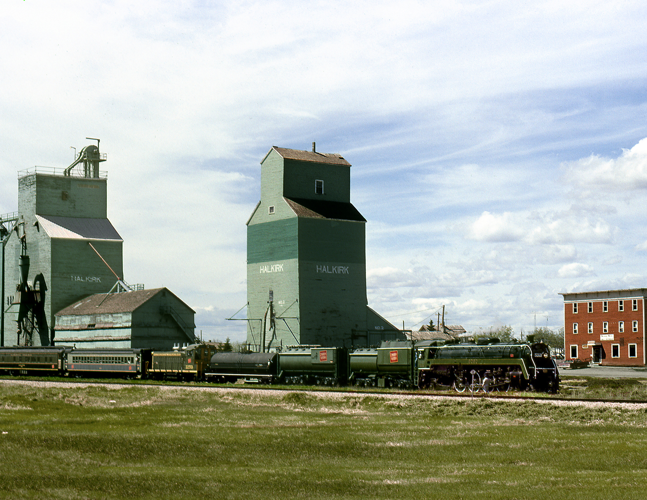 After being out of service for 10 years, ex CN 4-8-2 6060 makes its first run under auspices of the Alberta Prairie Railway on Central Western's ex CP Lacombe Sub. from Stettler to Coronation. The eastbound trip stops at Halkirk for servicing