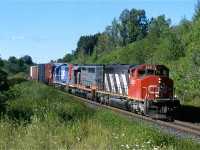 It still boggles my mind how quick the SD40 fleets have disappeared from North America's railroads. It is hard to believe they were once more plentiful on CN then today's fleet of ES44's. In 2000 they were still a dime a dozen, and could be found almost on every train. CN over the past couple of decades has had a colourful mix of SD40s, from a variety of railroads: GTW, IC, WC, DWP, and BC Rail, not to mention the leased units. A trio of SD40s are seen here hauling train 395 through the curve at mile 30 of the Halton subdivision. They are CN, GCFX and DWP linage.