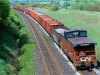 The days assignment for SD40U #6024 is to work a ballast train on the north track of the busy Kingston subdivision. The days of seeing a caboose out on the mainline are pretty much history, so catching one operating as a rider car is as good as it gets these days. The crew of the train is seen making the most of a work window, and are slowly walking along the train dumping ballast where needed. Once the train was west of Newtonville the power ran around the train then headed to Belleville to tie up for the day.