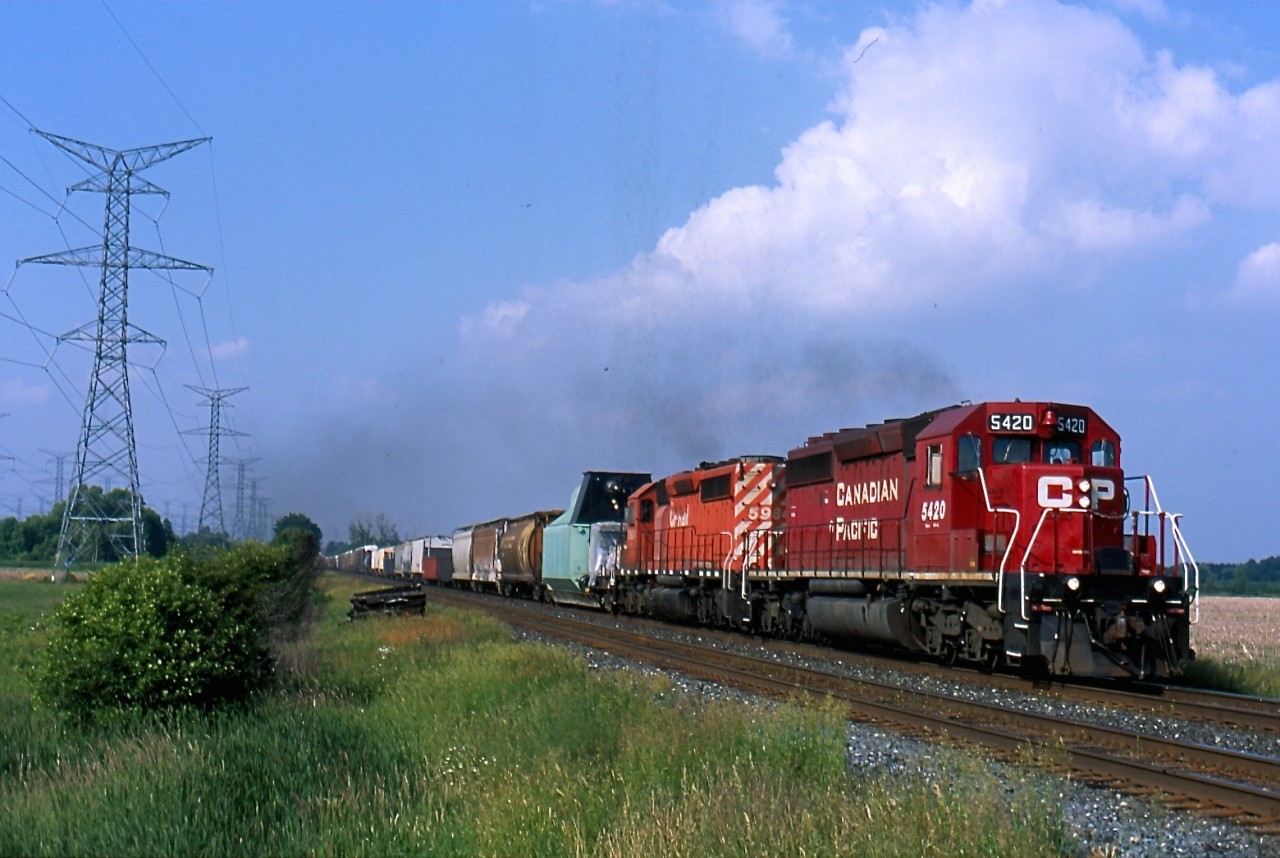 CP 5420 was the last active SD40 out of the group of former KCS units CP picked up from Helm leasing. The unit started life as KCS 675 and is seen leading train 441 out of the dip at Hornby, with an interesting dimension load behind the power.