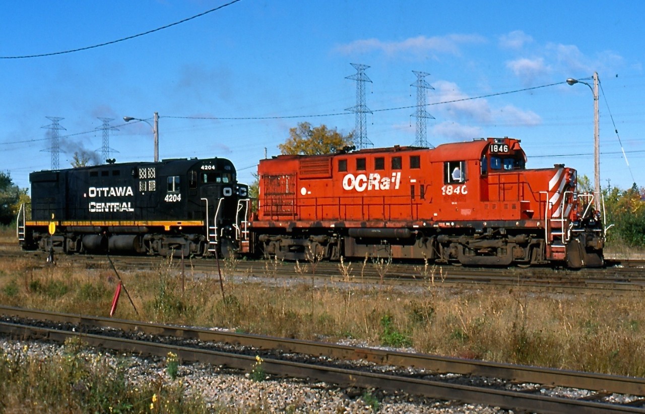 It is hard to believe for those who pass by CN's Walkley yard in Ottawa, but it was once a bustling place filled with former CP MLW's. On a brisk October morning in 2001 a pair of ex CP MLW's are busy switching in the yard. The 1846 last worked for the Quebec Gatineau RR until the railroad retired all of its MLW's, while 4204 was the OC's only C424. Today the yard is a much quieter place since CN took it back and usually one GP38 is enough power for all local switching.