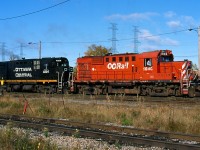 It is hard to believe for those who pass by CN's Walkley yard in Ottawa, but it was once a bustling place filled with former CP MLW's. On a brisk October morning in 2001 a pair of ex CP MLW's are busy switching in the yard. The 1846 last worked for the Quebec Gatineau RR until the railroad retired all of its MLW's, while 4204 was the OC's only C424. Today the yard is a much quieter place since CN took it back and usually one GP38 is enough power for all local switching.