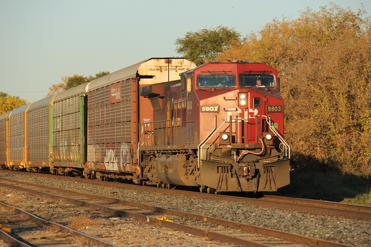 A westbound CP freight of all autoracks, and led by a solo GE, heads into the setting autumn sun at Ayr. Another westbound of all autoracks was right on its heels. This train may have been one of two CP 147s.