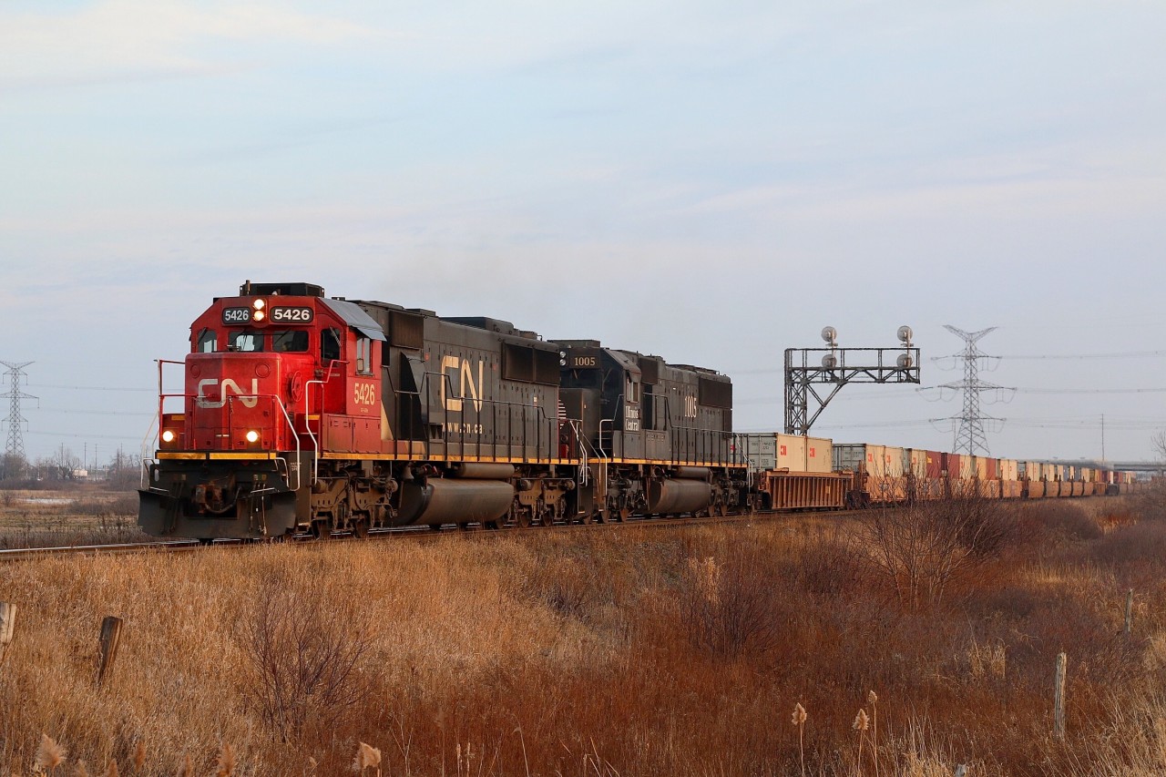 The newest and last two standard cab versions of EMD road units picked up by CN are represented here as CN train 148 rolls through Mansewood three days before Christmas. The SD60s are former Oakway units while the SD70s came through the takeover of Illinois Central.