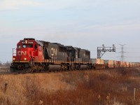 The newest and last two standard cab versions of EMD road units picked up by CN are represented here as CN train 148 rolls through Mansewood three days before Christmas. The SD60s are former Oakway units while the SD70s came through the takeover of Illinois Central. 