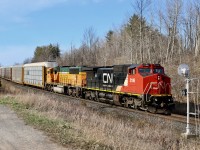 The landscape surrounding the one time North & Northwestern Railroad line through Scotch Block remains dormant and lifeless as train 399 with a former BNSF/ATSF Dash- 8 paired up with a BNSF SD70mac hustle along what became the CN Halton sub. back in the 1960s.