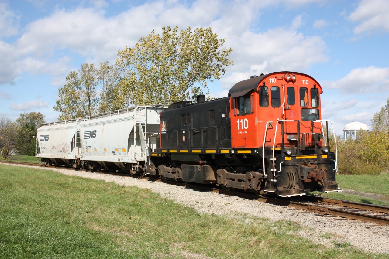Trillium S13 110 is about to back down the one time connecting track between CN and the Canada Southern mainline. Today this is the spur to Vesuvius. The rebuilt Welland canal in 1970 cut the CASO main in half, forcing its relocation south of Welland. This spur exists to serve only one industry and the CASO yard here was relocated at the same time. Today Trillium operates all former CN and CP trackage in the area, although much has been relocated or abandoned.
