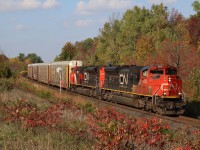 The fall colours are beginning to take hold at Mile 30 as train 435 rolls past with a pair of SD70M-2s.