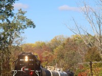 A splash of fall colour covers the landscape at Churchille on Brampton's west side, as the OBRY southbound trundles by, while housing developments are creeping closer, there is still some countryside left along the Credit River here. 